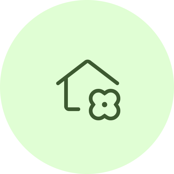 A green circle with an image of a house and a flower.